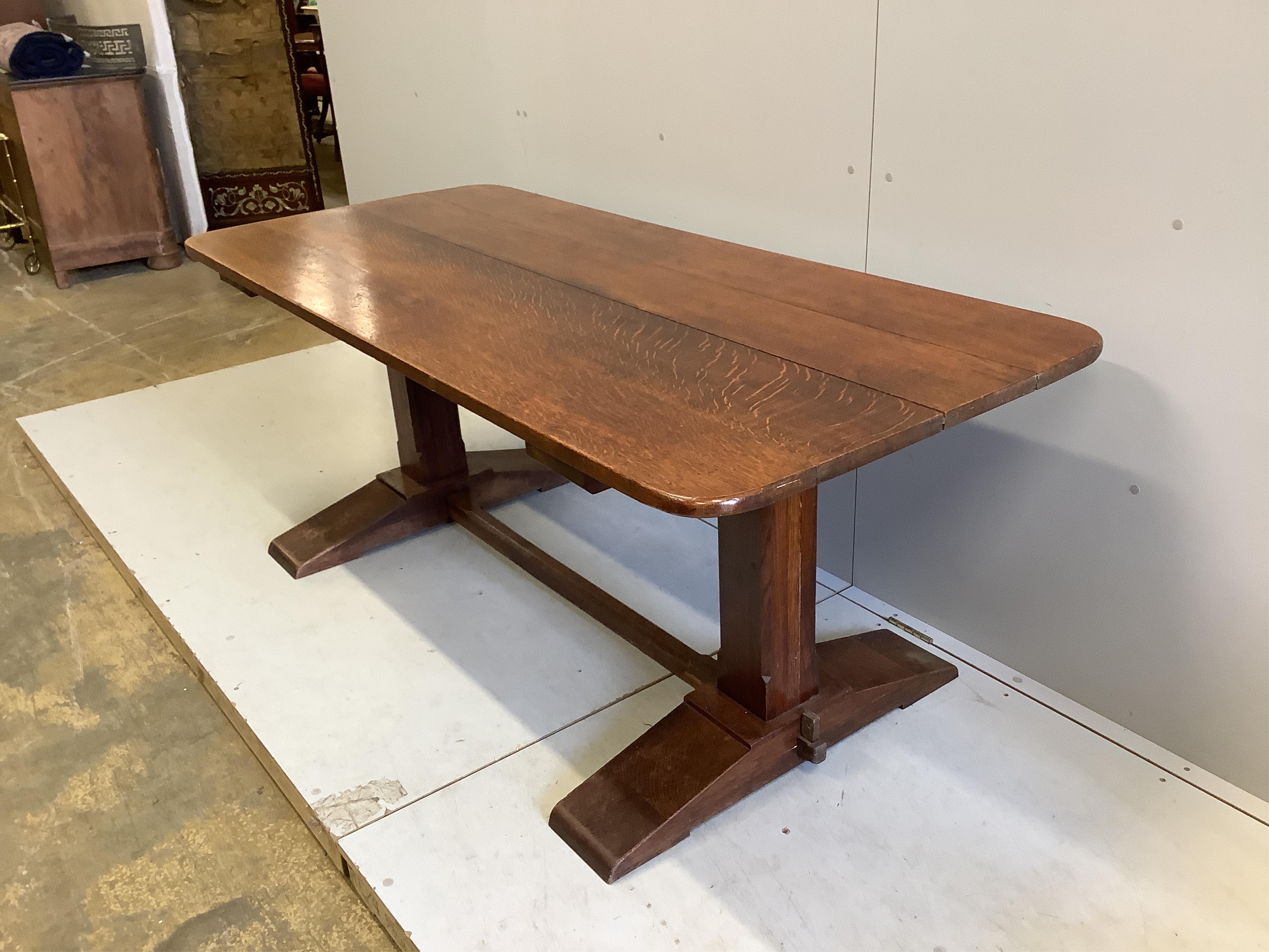 A 18th century style rectangular oak refectory dining table, width 183cm, depth 82cm, height 74cm and six rush seat ladderback chairs